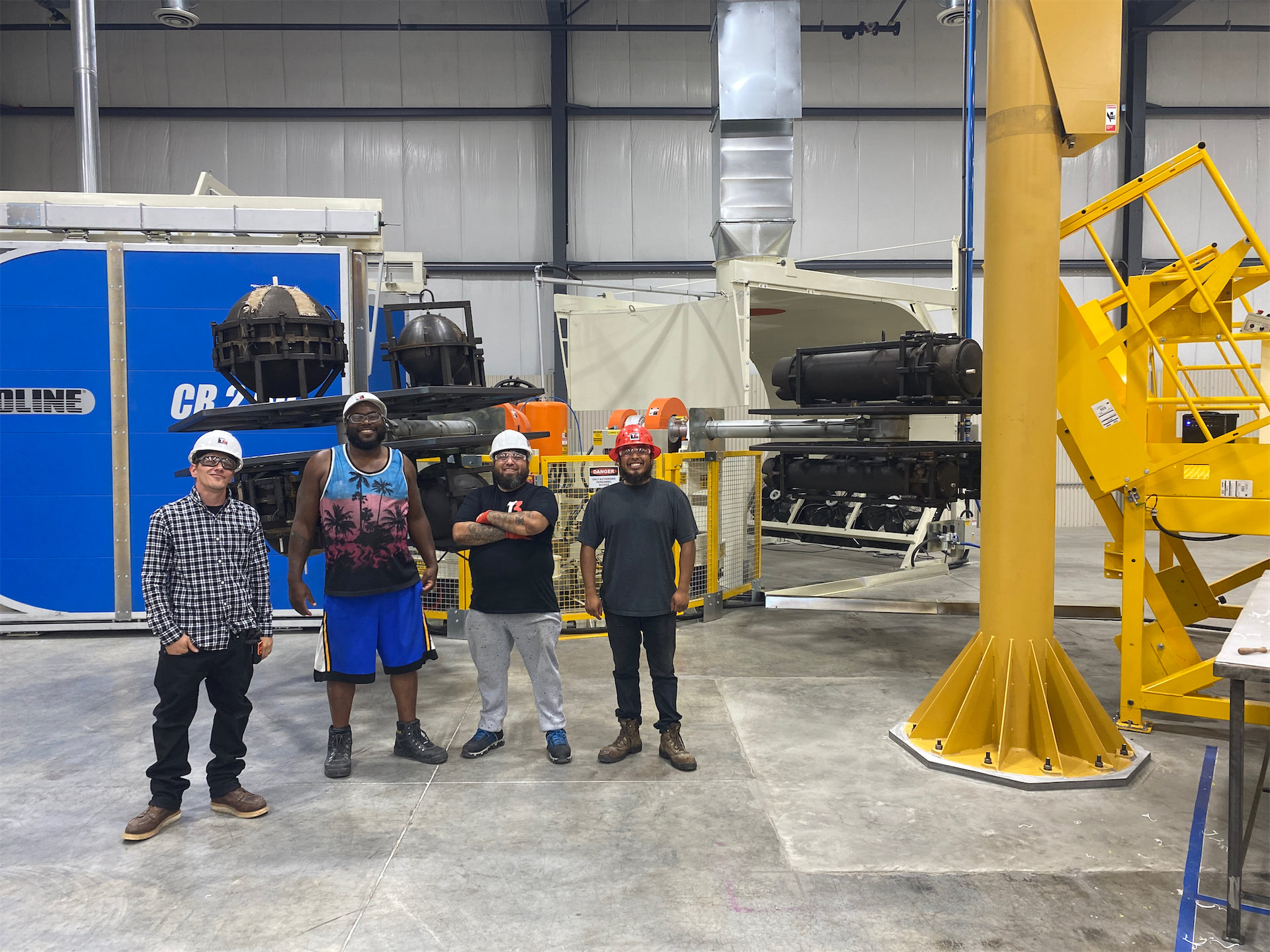 4 T3 employees on the factory floor
